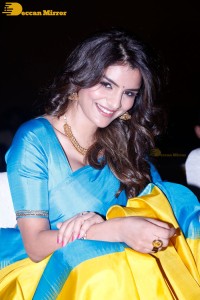 Actress Anveshi Jain in a blue and yellow saree