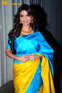 Actress Anveshi Jain in a blue and yellow saree