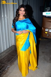 Actress Anveshi Jain in a blue and yellow saree