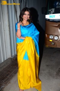 Actress Anveshi Jain in a blue and yellow saree