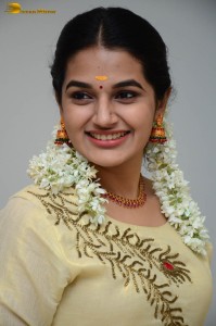 actress aparna janardanan cute looks in a light yellow salwar kameez