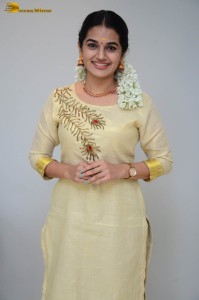 actress aparna janardanan cute looks in a light yellow salwar kameez