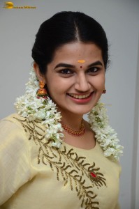 actress aparna janardanan cute looks in a light yellow salwar kameez