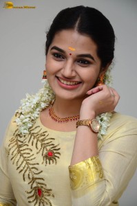 actress aparna janardanan cute looks in a light yellow salwar kameez