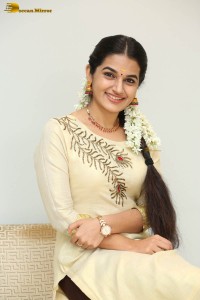 actress aparna janardanan cute looks in a light yellow salwar kameez