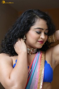 actress Apsara Rani sexy photoshoot in a white and blue saree