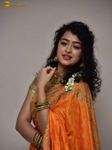 actress Apsara Rani red-hot looks in a orange saree