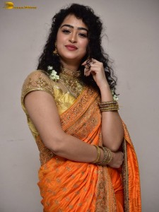 actress Apsara Rani red-hot looks in a orange saree
