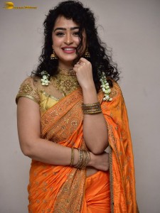 actress Apsara Rani red-hot looks in a orange saree