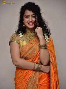 actress Apsara Rani red-hot looks in a orange saree
