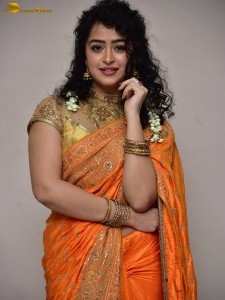 actress Apsara Rani red-hot looks in a orange saree