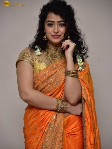 actress Apsara Rani red-hot looks in a orange saree