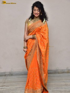 actress Apsara Rani red-hot looks in a orange saree