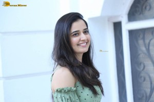 actress ashika ranganath in a green top