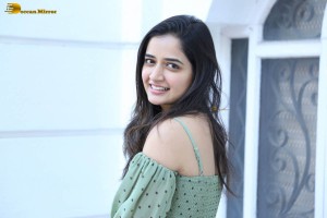 actress ashika ranganath in a green top