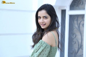 actress ashika ranganath in a green top