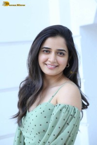 actress ashika ranganath in a green top