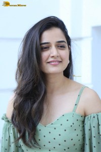 actress ashika ranganath in a green top