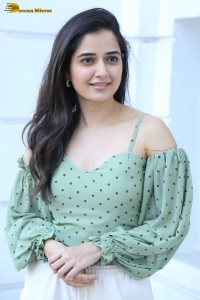 actress ashika ranganath in a green top