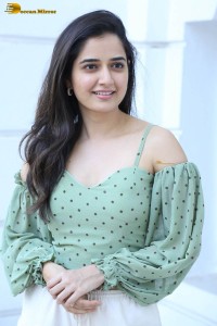 actress ashika ranganath in a green top