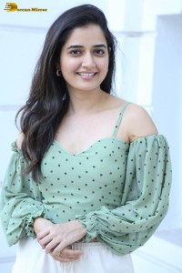 actress ashika ranganath in a green top