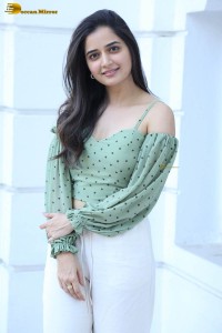actress ashika ranganath in a green top