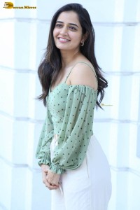 actress ashika ranganath in a green top