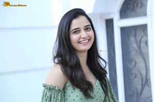 actress ashika ranganath in a green top