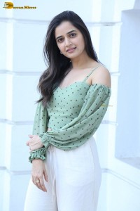 actress ashika ranganath in a green top