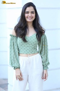 actress ashika ranganath in a green top