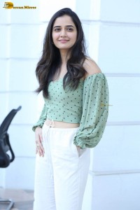 actress ashika ranganath in a green top