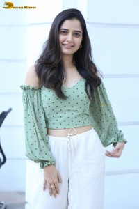 actress ashika ranganath in a green top