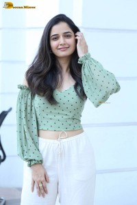 actress ashika ranganath in a green top