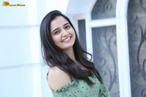 actress ashika ranganath in a green top