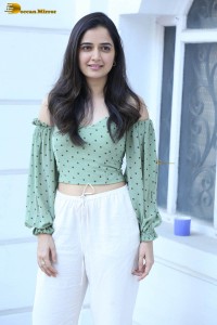 actress ashika ranganath in a green top