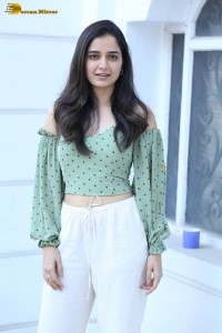 actress ashika ranganath in a green top