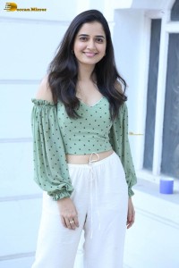 actress ashika ranganath in a green top