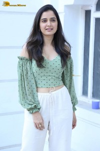 actress ashika ranganath in a green top