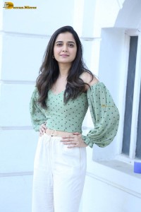 actress ashika ranganath in a green top