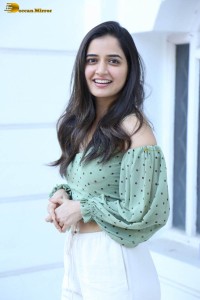 actress ashika ranganath in a green top