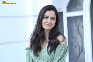 actress ashika ranganath in a green top