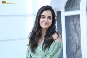 actress ashika ranganath in a green top