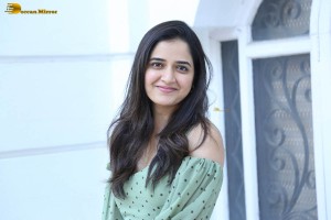 actress ashika ranganath in a green top