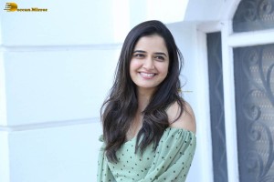 actress ashika ranganath in a green top