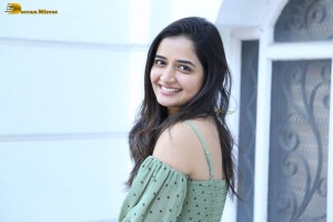 actress ashika ranganath in a green top