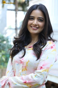 actress ashika ranganath in a white floral dress