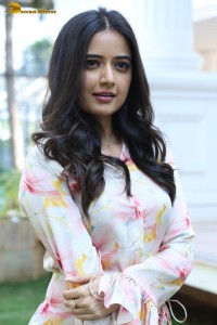 actress ashika ranganath in a white floral dress