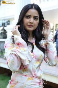 actress ashika ranganath in a white floral dress