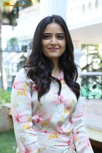 actress ashika ranganath in a white floral dress