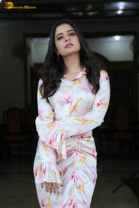 actress ashika ranganath in a white floral dress